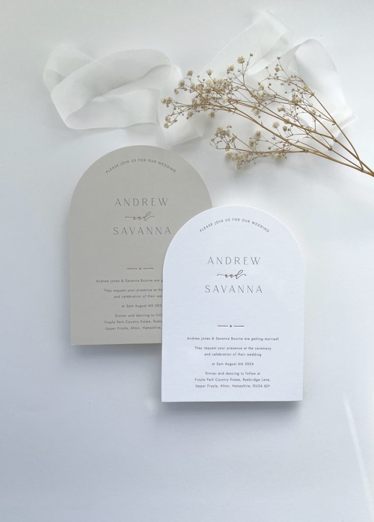 Arch sahped die cut wedding invitation with calligraphy details in luxury gold foil. Simple minimalist type and available on white or nude card