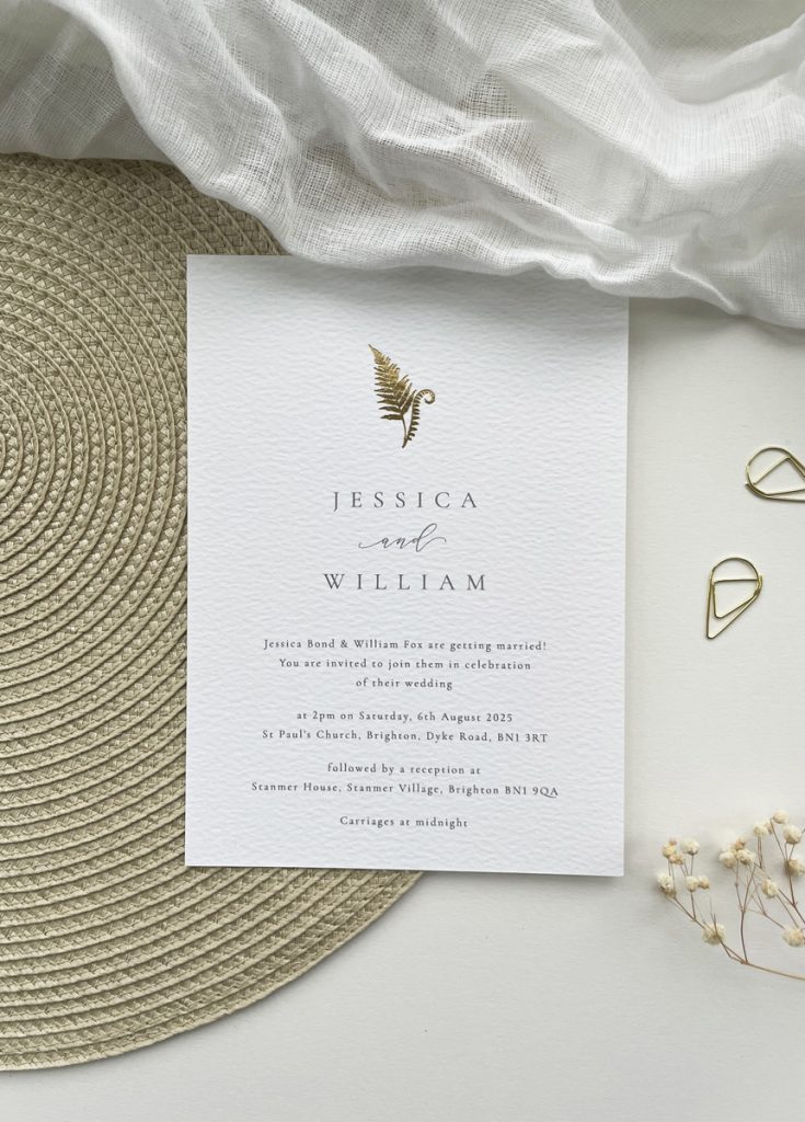 modern minimalist botanical fern wedding invite card with gold foil fern on white card