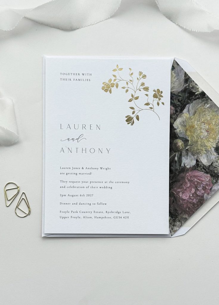 A luxury wedding invitation featuring a minimalist gold foil rose design in the top right hand corner, ideal for romantic, garden, or boho weddings. Printed on premium white card, this elegant floral invite combines timeless charm with clean, modern typography.