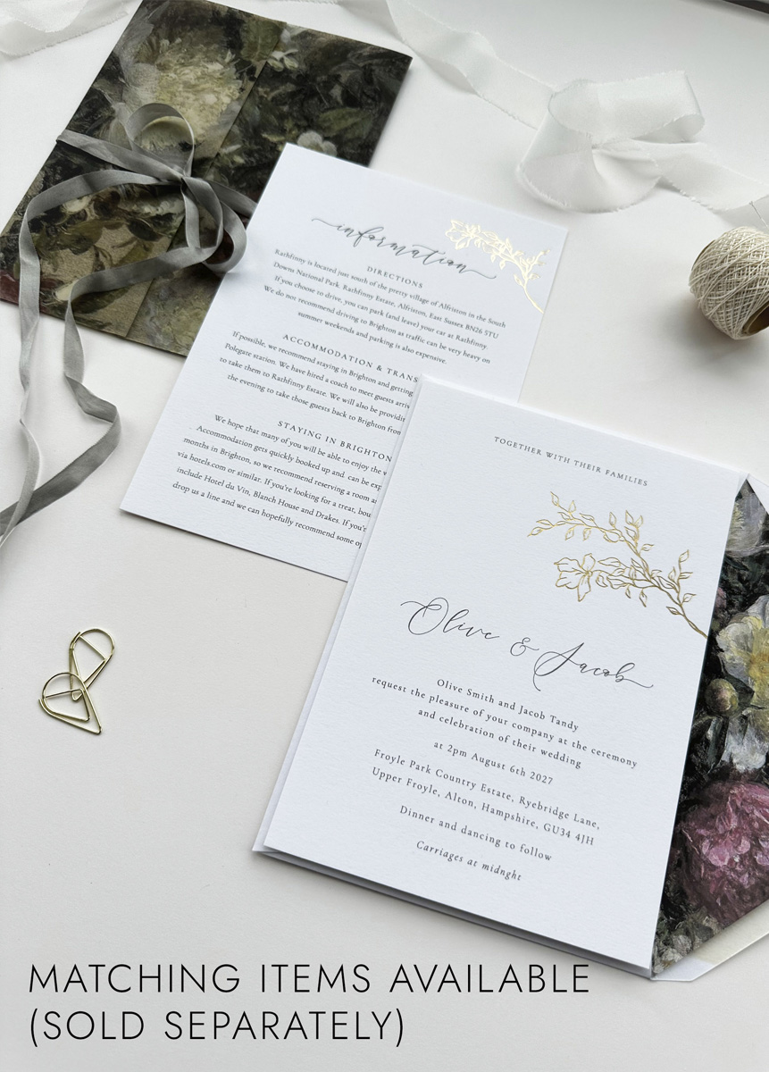 Gold foil floral wedding invite on textured white card with romantic script and neutral tones, luxury stationery suite.