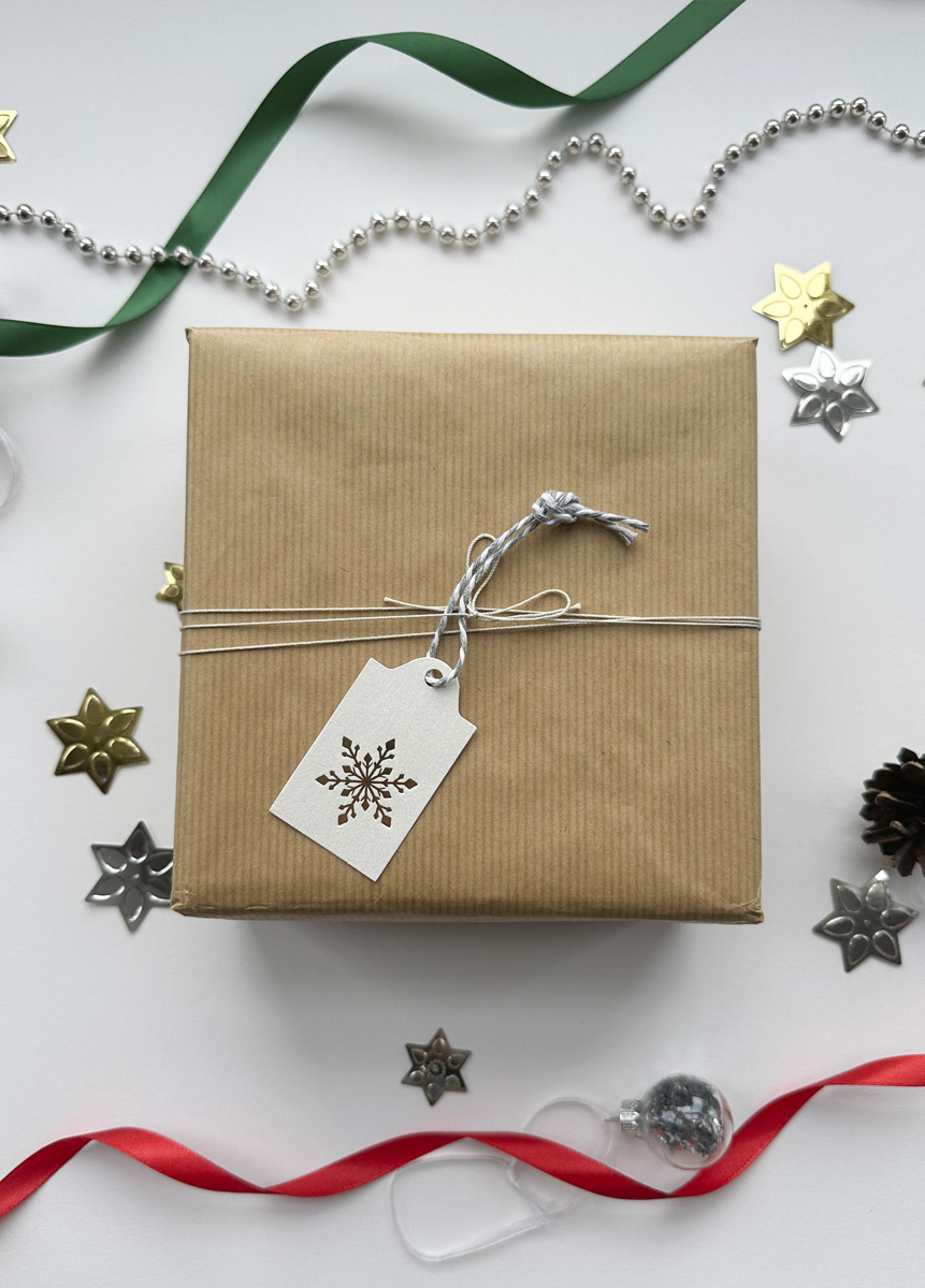 Handmade Christmas tag with metallic gold foil snowflake design