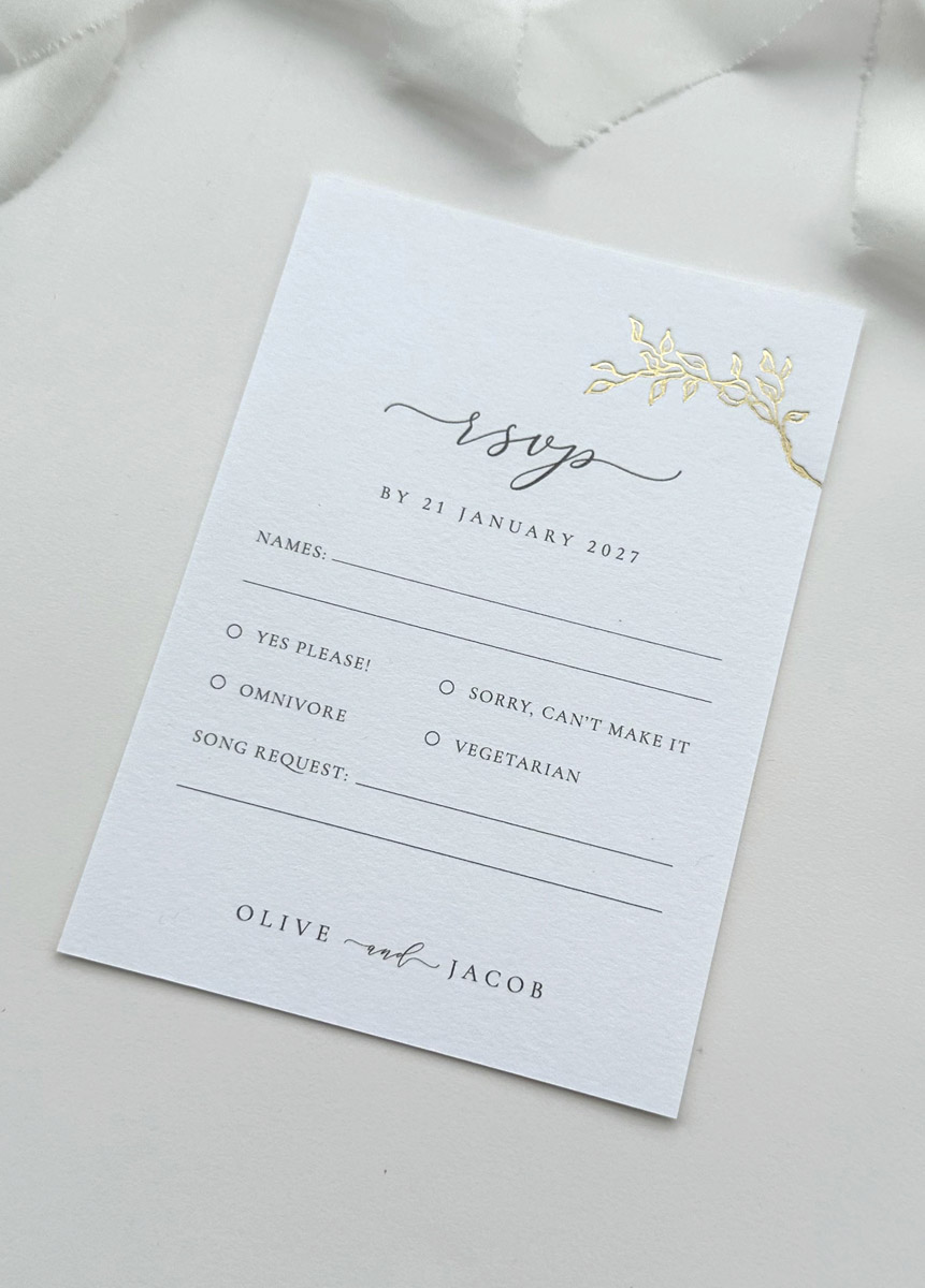 Luxury gold foil vintage rose RSVP card on thick white card with elegant botanical illustration and minimalist wedding stationery design
