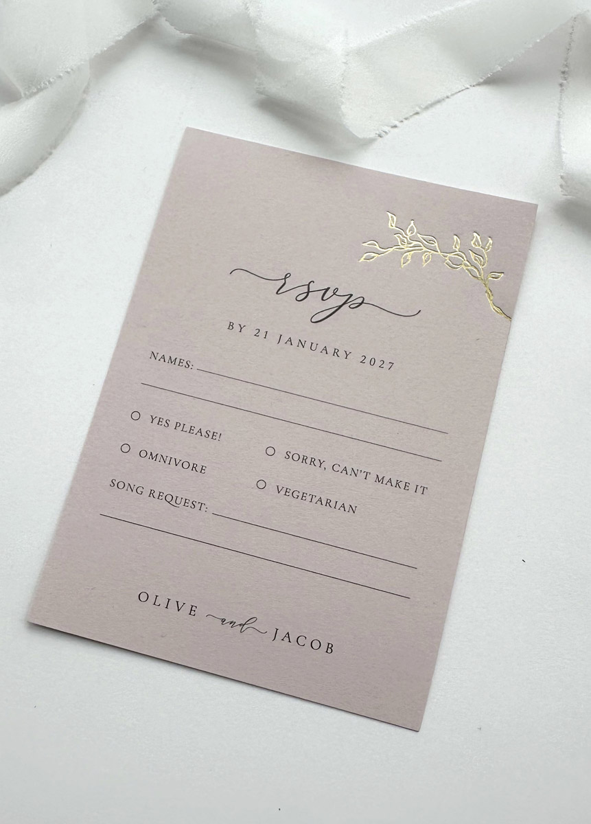 Romantic wedding RSVP card featuring hand foiled gold floral detail and luxury blush pink card