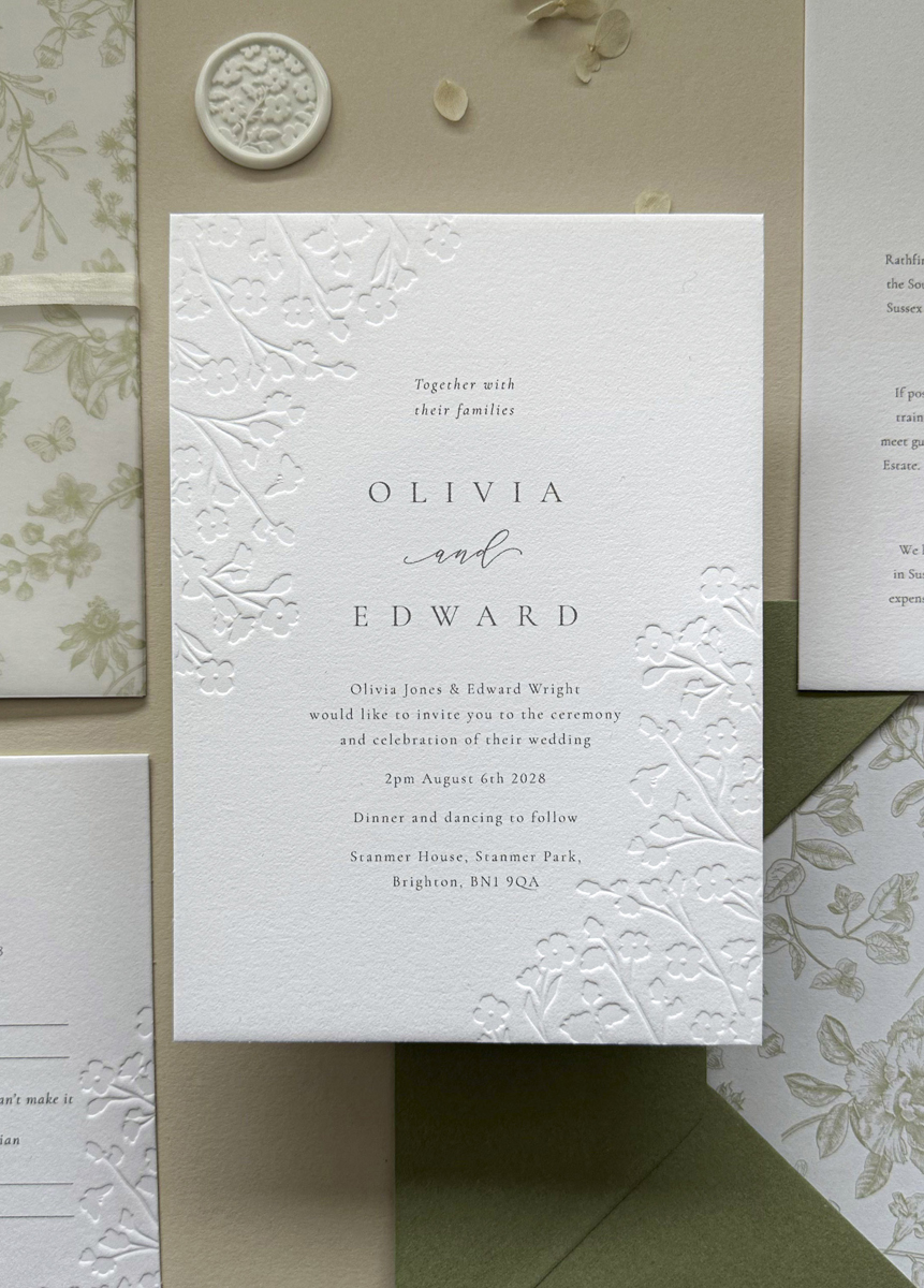 Luxury floral embossed wedding invitation suite with sage green envelope and botanical envelope liner printed on thick cotton card.