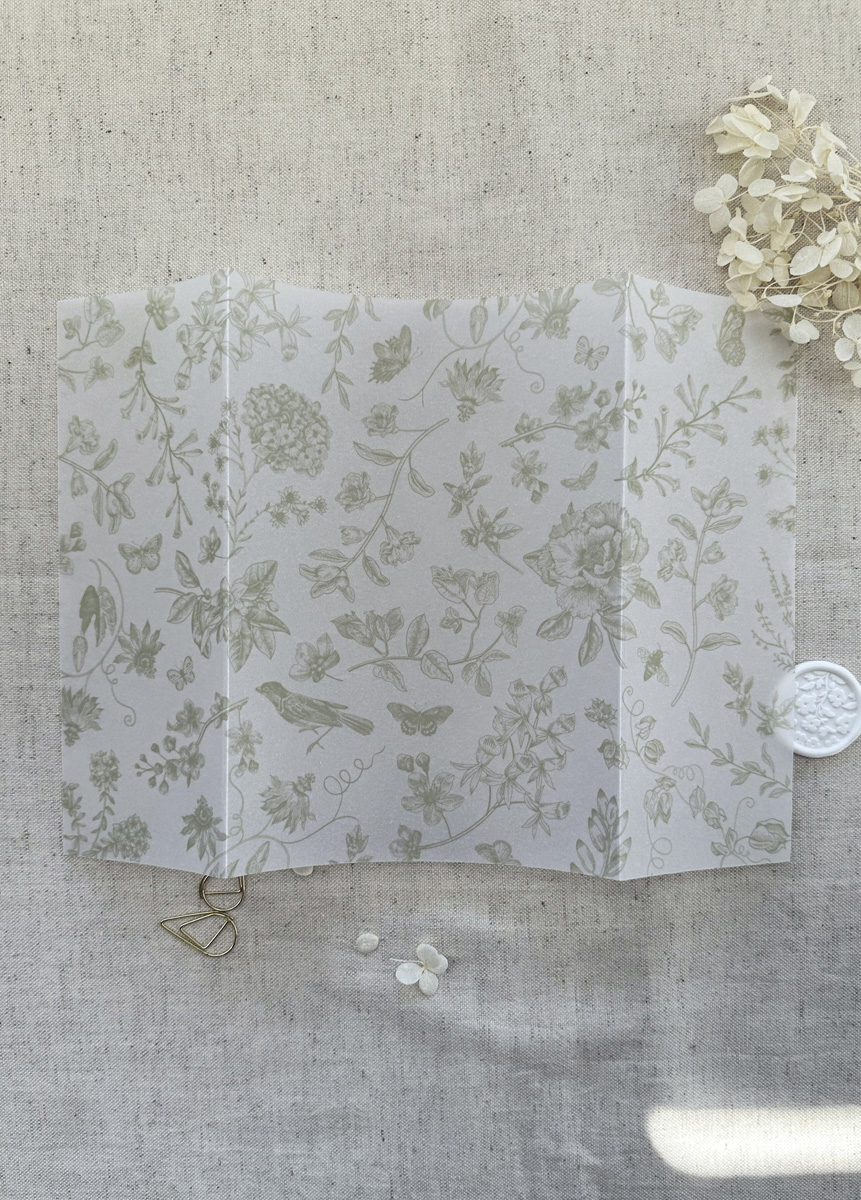 Vellum wrap or vellum jacket gatefold to house a 5x7 wedding invite with baroque floral design in sage green