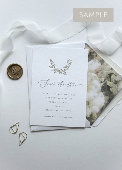Luxury gold foil wedding save the date card with a hand drawn vintage rose design in gold foil