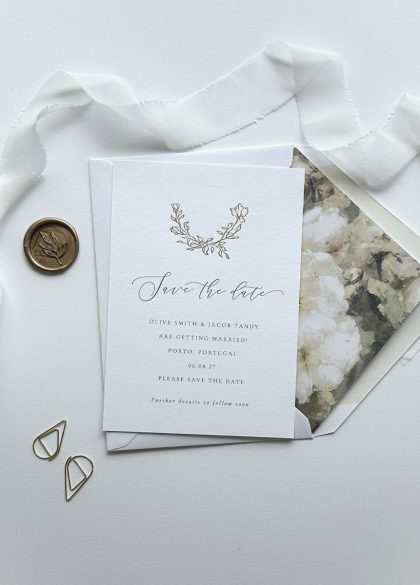 Luxury gold foil rose Save the Date card paired with a coordinating envelope, printed on premium cotton card for elegant wedding stationery.
