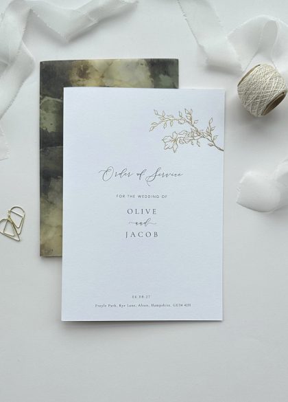 White printed wedding order of service booklet with a vintage rose floral design in elegant gold foil