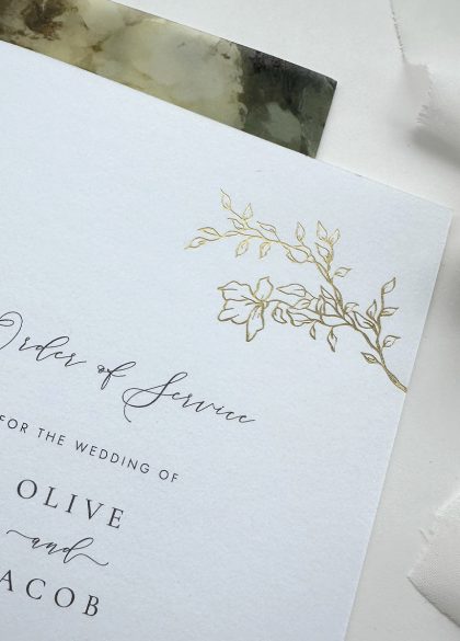 elegant wedding order of service with a hand drawn vintage rose design in gold foil and calligraphy script type
