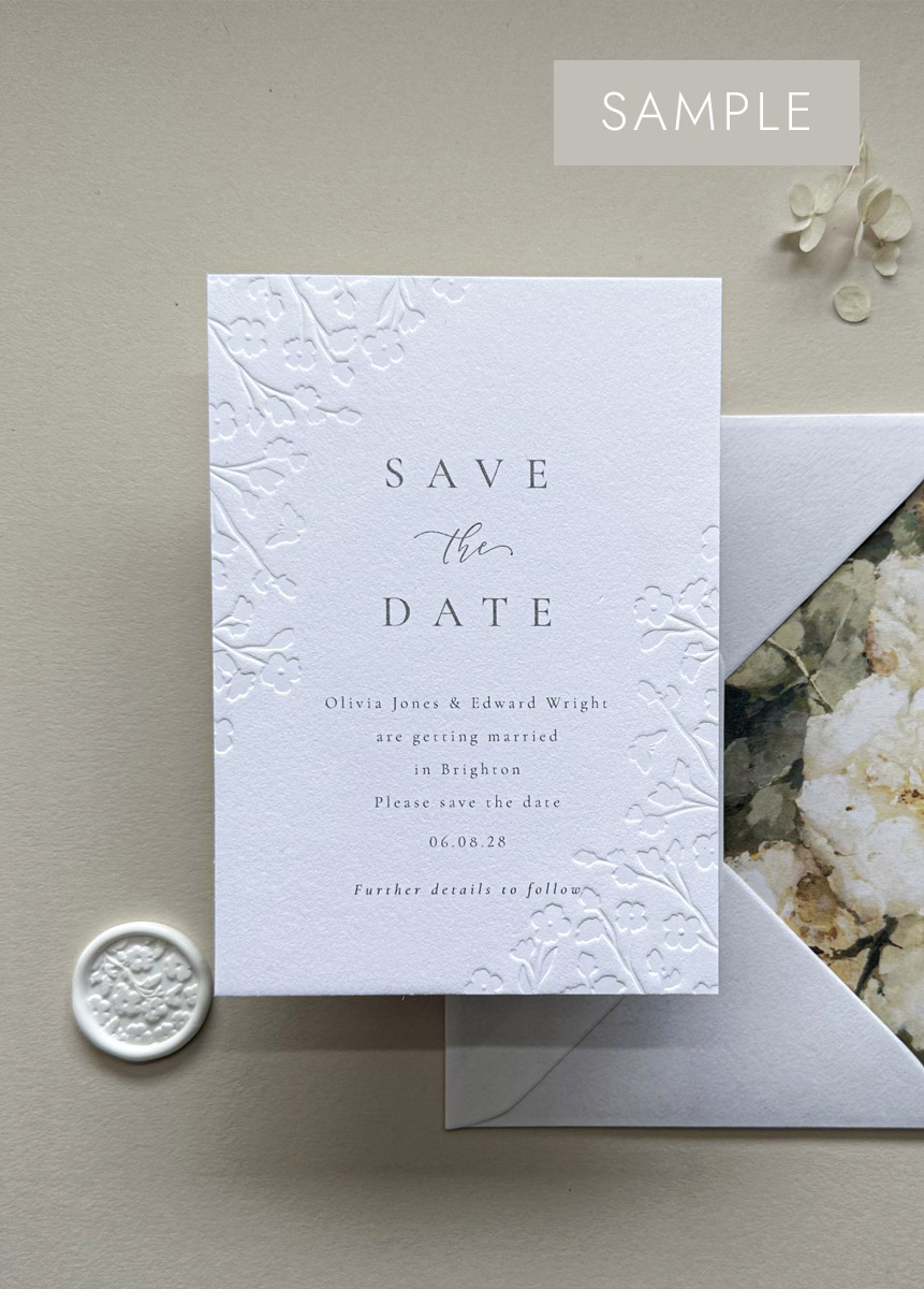 Matching floral embossed Save the Date from the luxury wedding stationery collection, coordinating with wedding invitations, RSVP cards and on-the-day stationery.