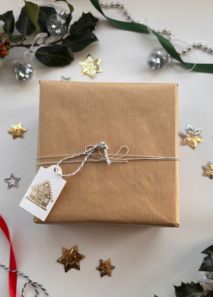 Gold foil gingerbread house Christmas gift tags printed on pearlescent card by Gorgeous Paper.