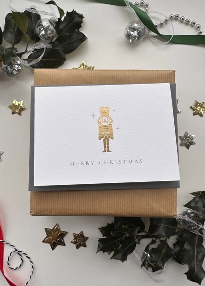 Gold foil nutcracker Christmas card by Gorgeous Paper with an elegant festive design.